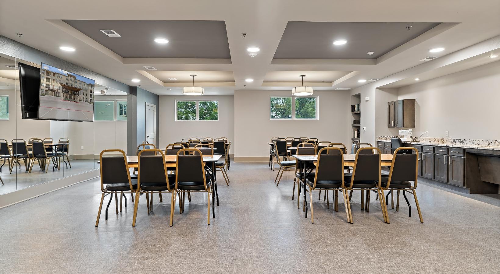 Settle into comfort at Preserve at Willow Park a room with many tables and chairs