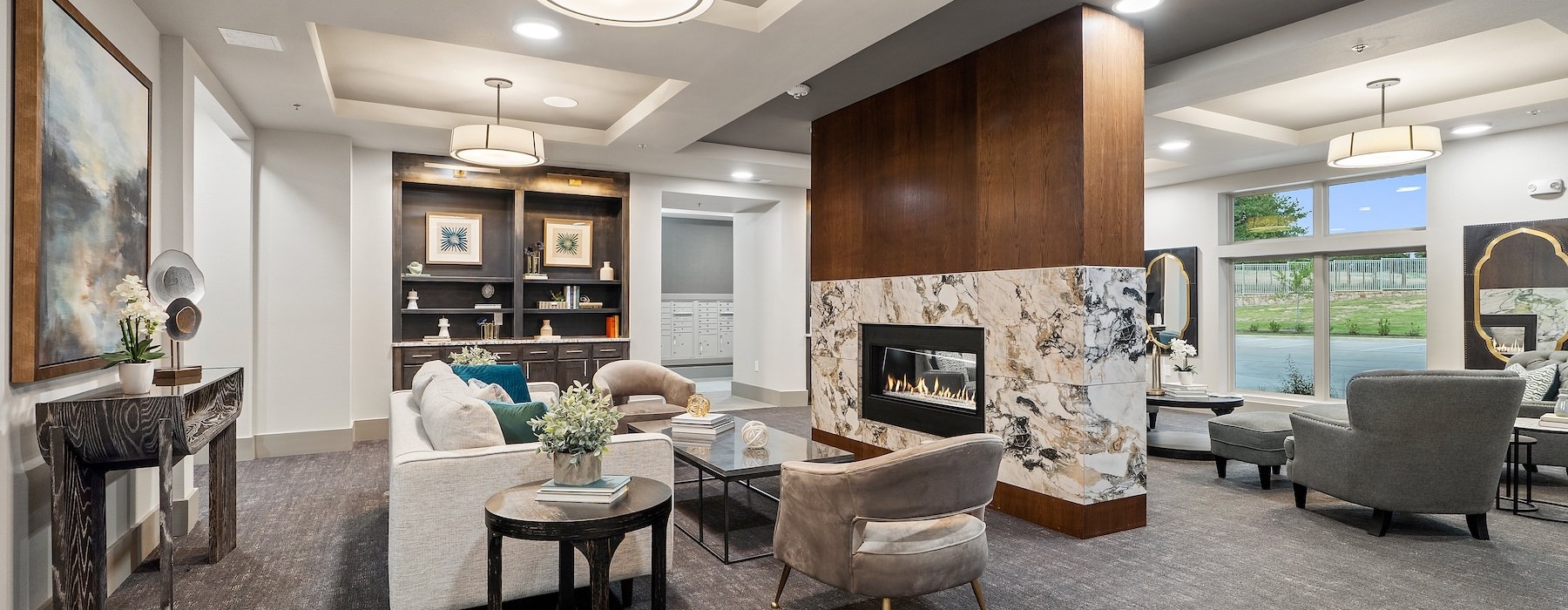 a lounge room with a fireplace and seating