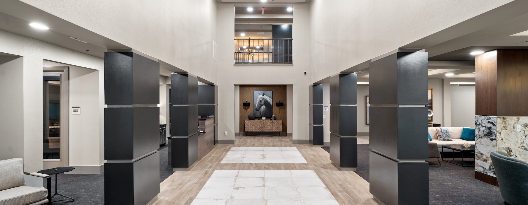 a room with a fireplace and a tile floor hallway