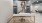 a room with a desk and chair and painting