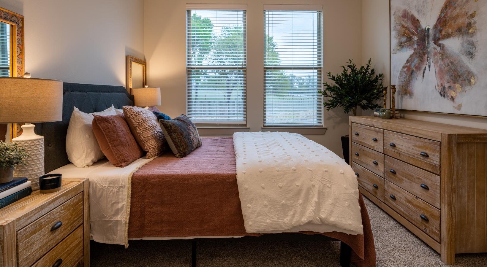 Bedroom options to fit every lifestyle a bedroom with a bed a wardrobe and windows