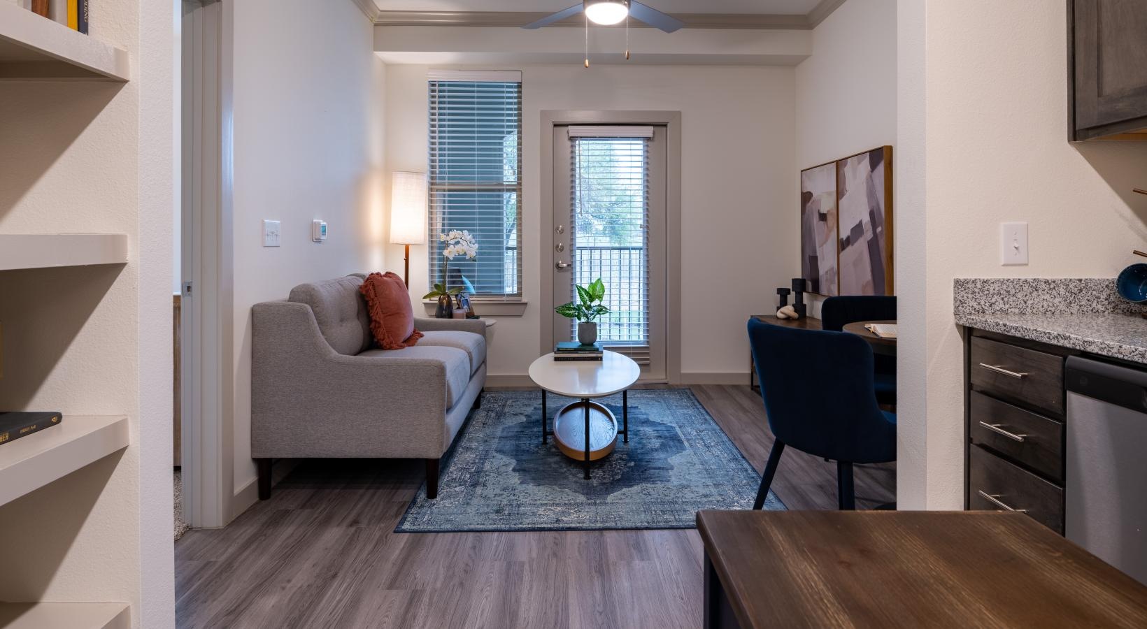 Beautiful living areas to match your lifestyle a living room with a wood floor and couch and windows