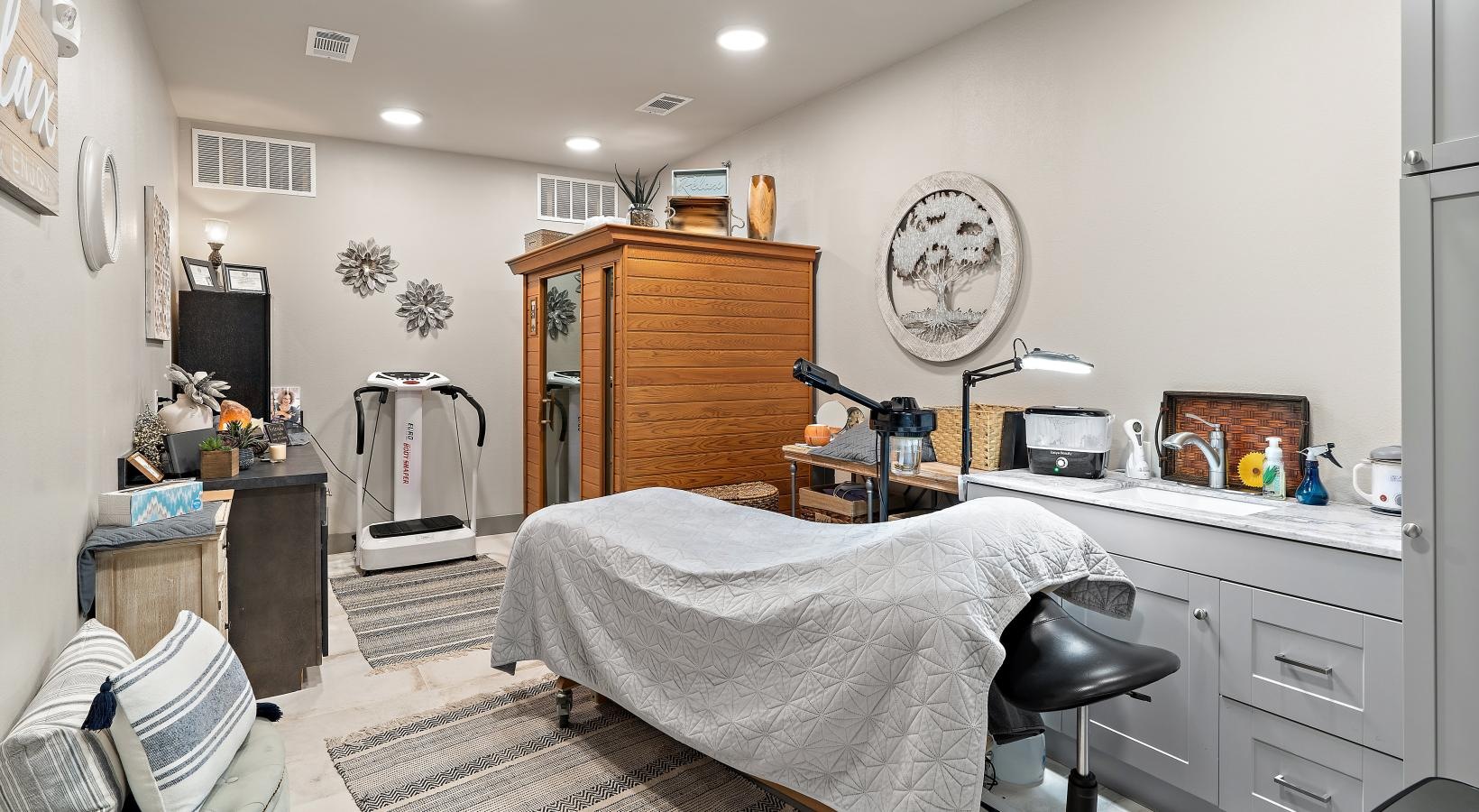 Beautiful bedrooms to fit every need a spa room with a spa bed and desk