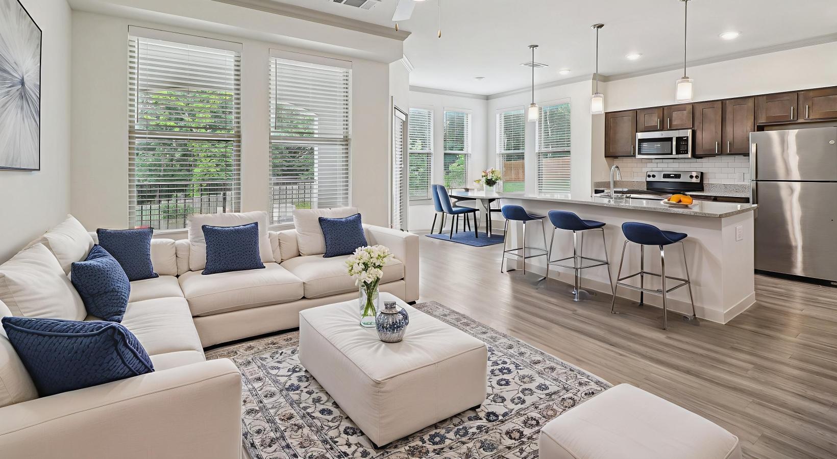 Wide open living areas perfect for entertaining a large living room with a large kitchen and a large windows