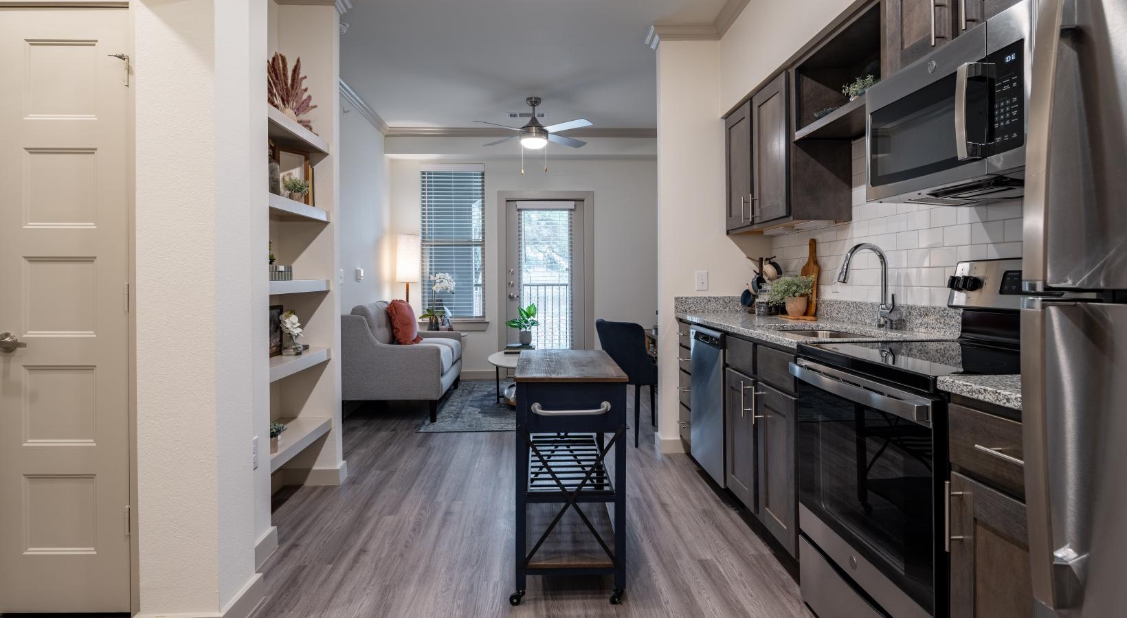 Beautiful kitchens with designer finishes a kitchen with a fridge stovetop sink and microwave